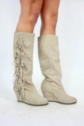 Bottes à franges et talons compensés