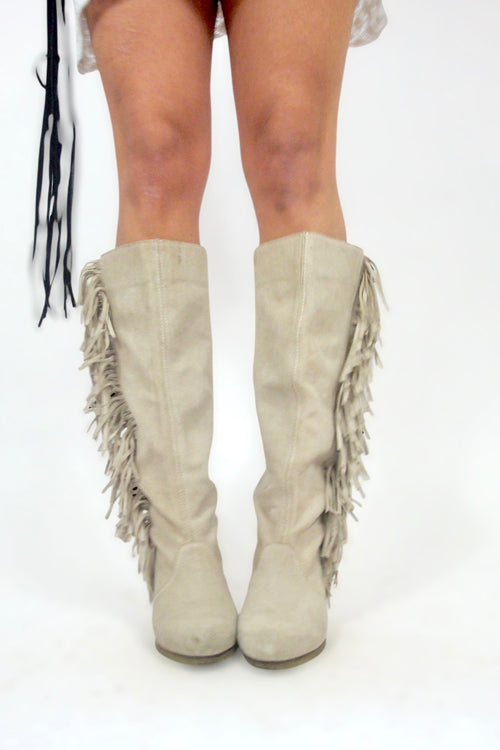 Bottes à franges et talons compensés
